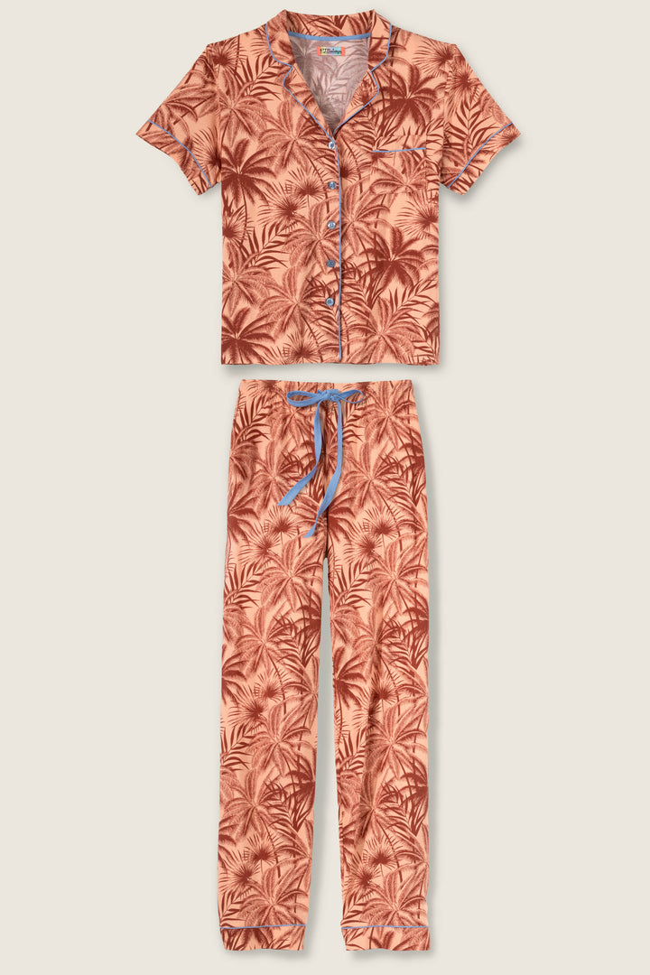 Women's breathable cotton-modal jersey short sleeve pajama set in amber-tan palm print with contrast blue piping. Button-front top & open leg tie-waist pant.