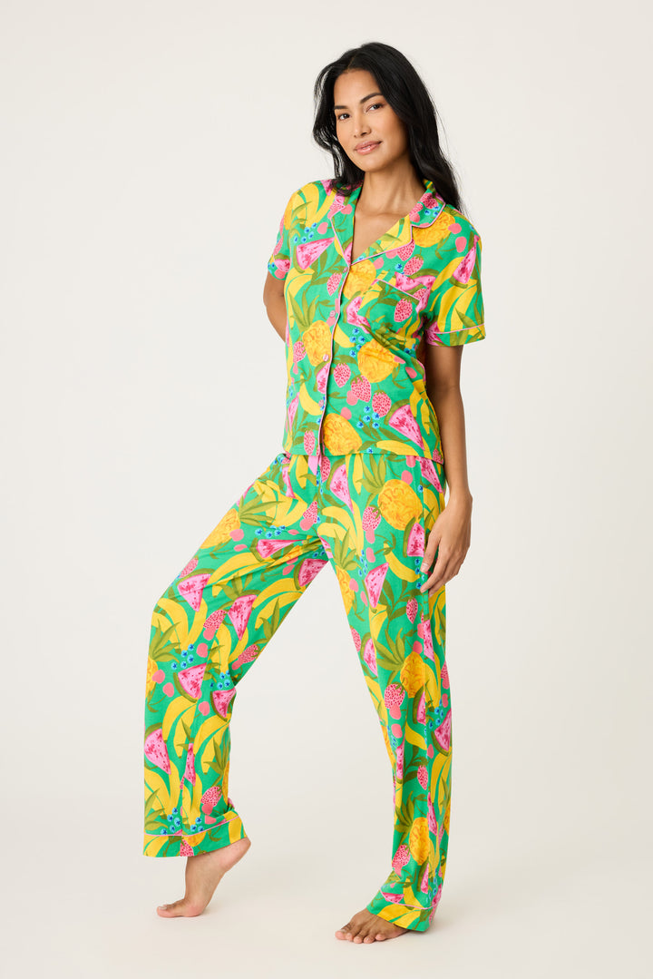 Women's breathable cotton-modal jersey short sleeve pajama set in multicolor fruit print with contrast pink piping. Button-front top & open leg tie-waist pant.