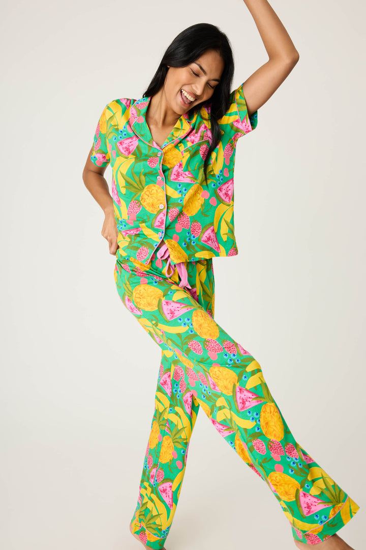 Women's breathable cotton-modal jersey short sleeve pajama set in multicolor fruit print with contrast pink piping. Button-front top & open leg tie-waist pant.