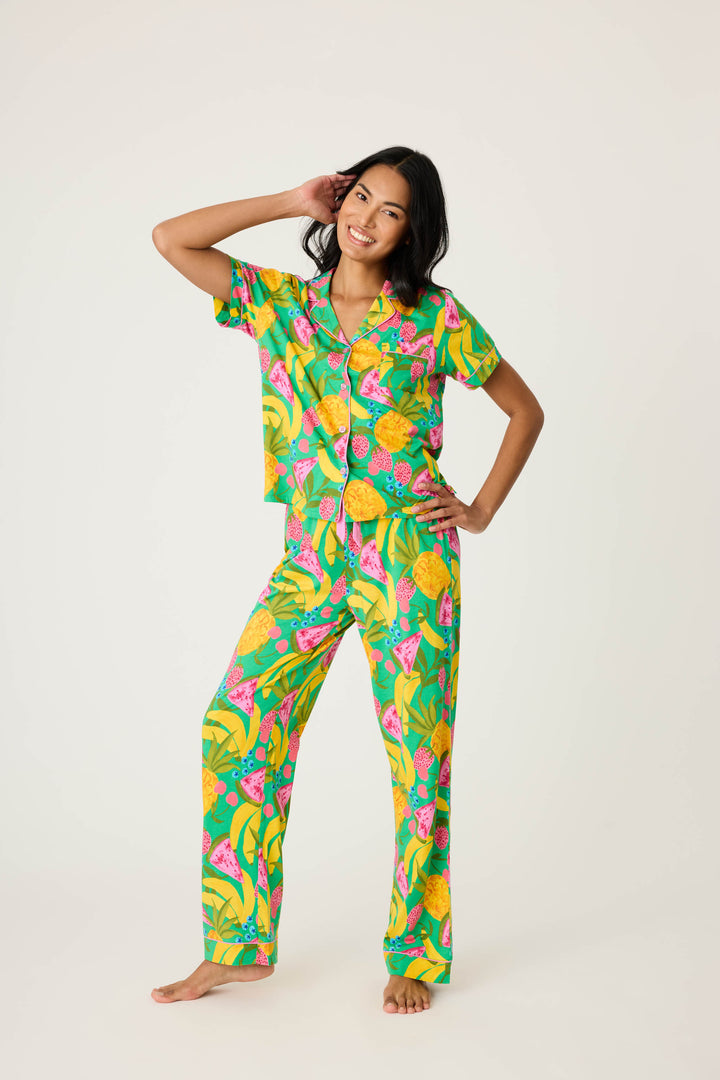 Women's breathable cotton-modal jersey short sleeve pajama set in multicolor fruit print with contrast pink piping. Button-front top & open leg tie-waist pant.