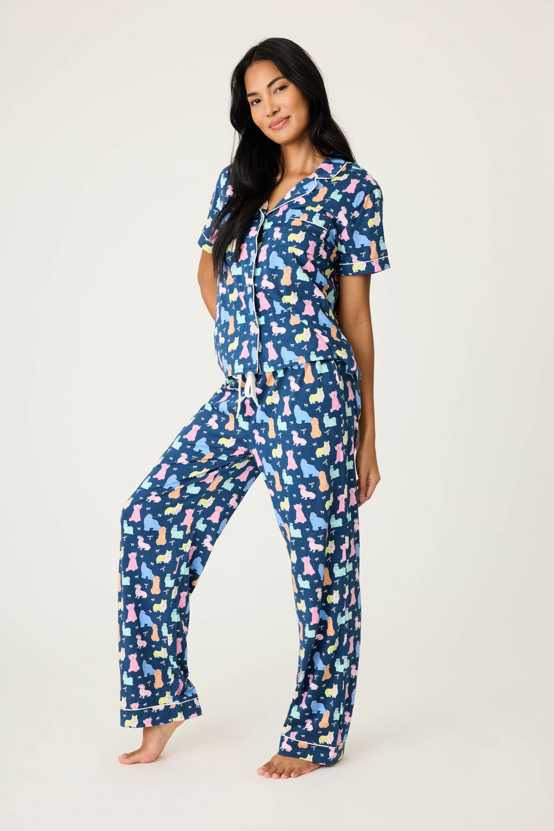 Women's breathable cotton-modal jersey short sleeve pajama set in navy w/pastel dog print with contrast ivory piping. Button-front top & open leg tie-waist pant.