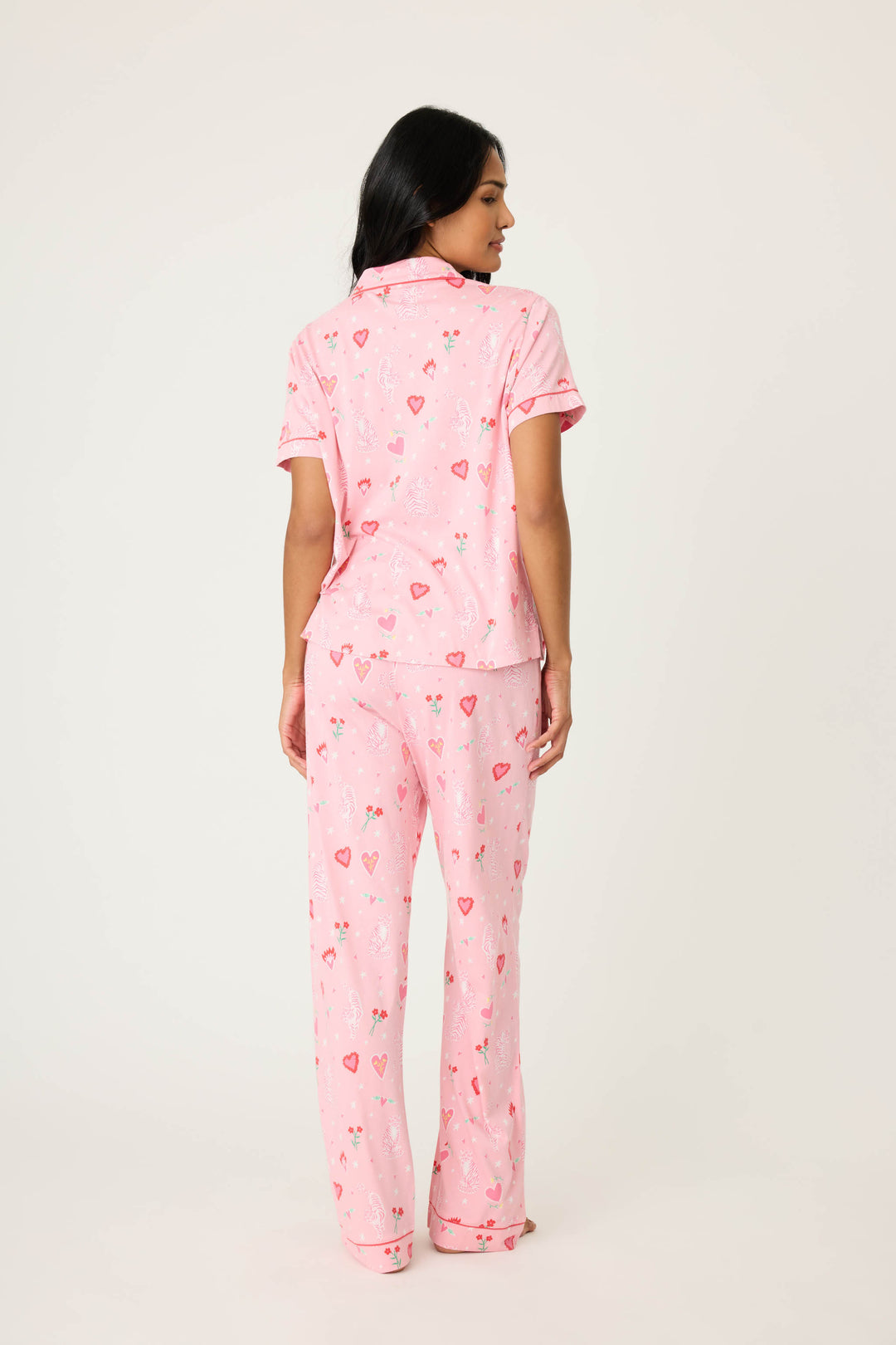 Women's breathable cotton-modal jersey short sleeve pajama set in pink mini tiger & heart print with contrast red piping. Button-front top & open leg tie-waist pant.