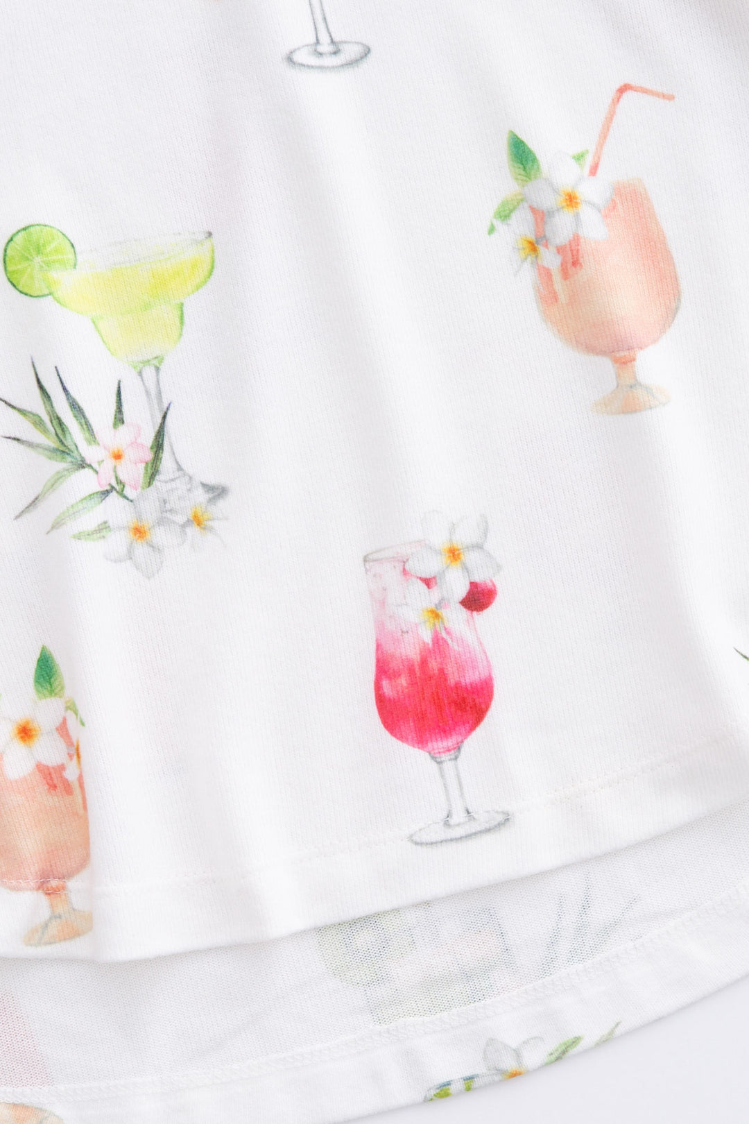 Printed tropical cocktails on ivory V-neck sleep tank top. Relaxed fit.