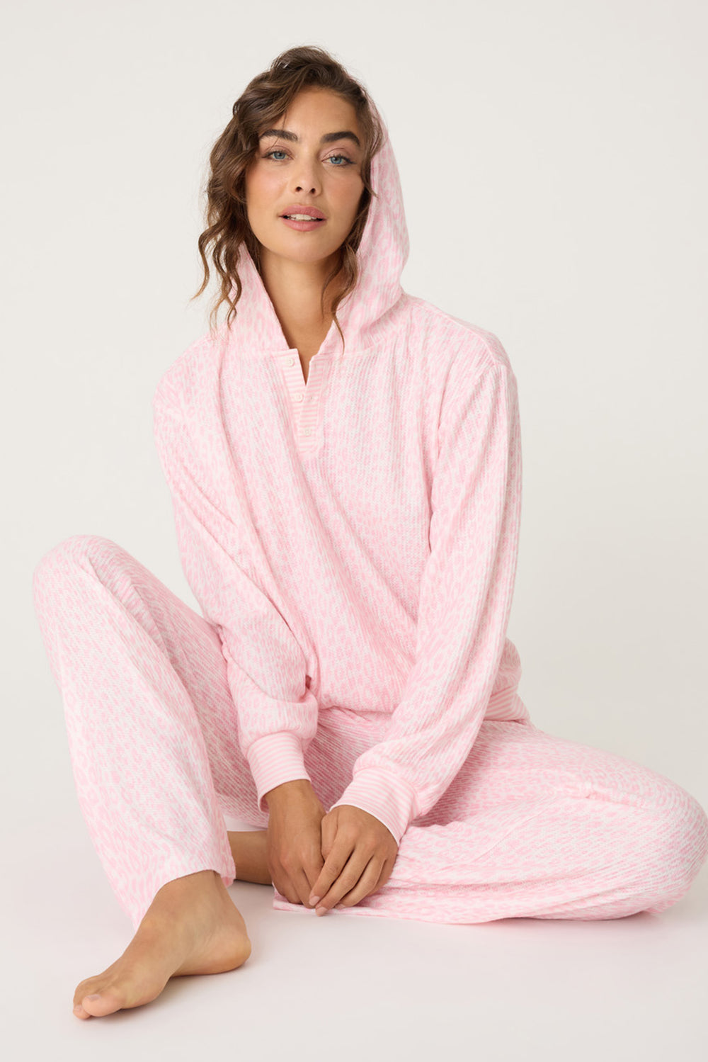 Women's pink-ivory leopard print lounge set. Pullover hoody with 3-button neckline & straight leg lounge pant with pockets & striped elastic waistband.