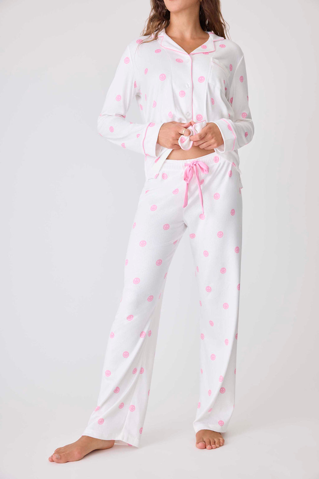 Women's ivory pajama pant with pink happy face pattern. Exclusive PJS x Susan G Komen style.