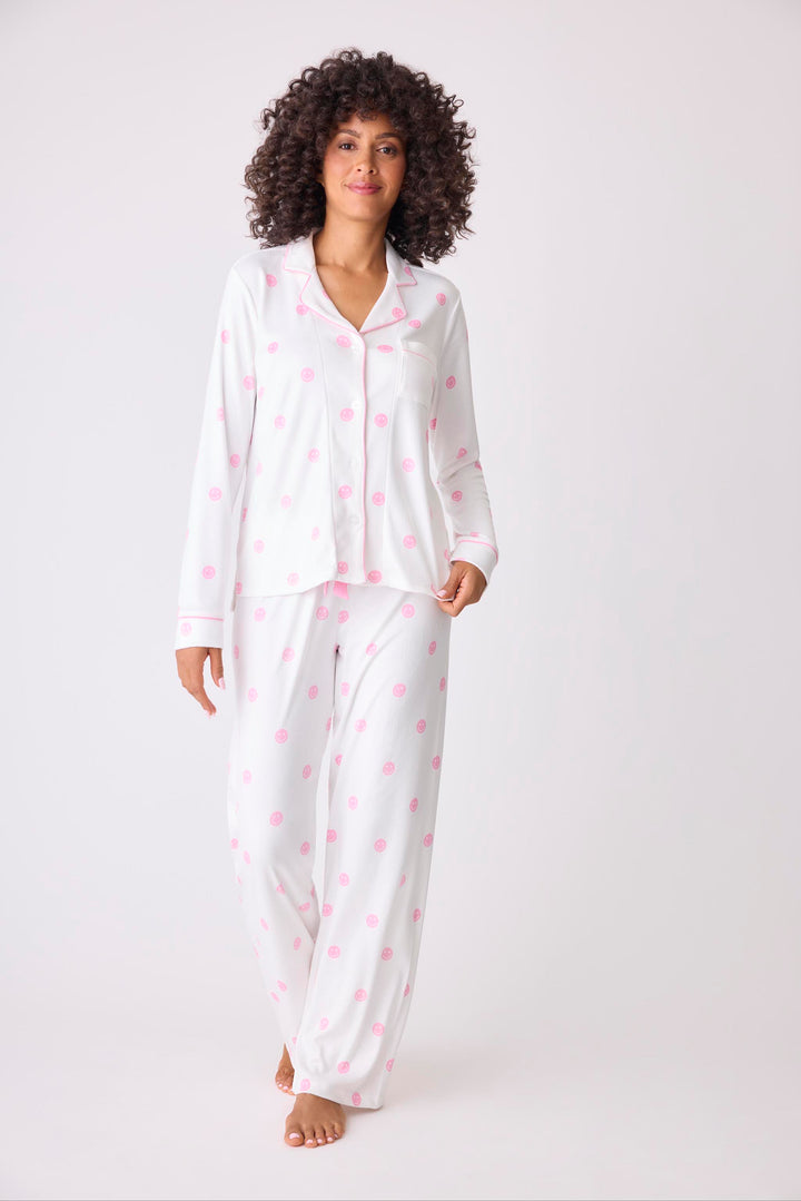 Women's ivory pajama set with pink happy face pattern. Exclusive PJS x Susan G Komen style.