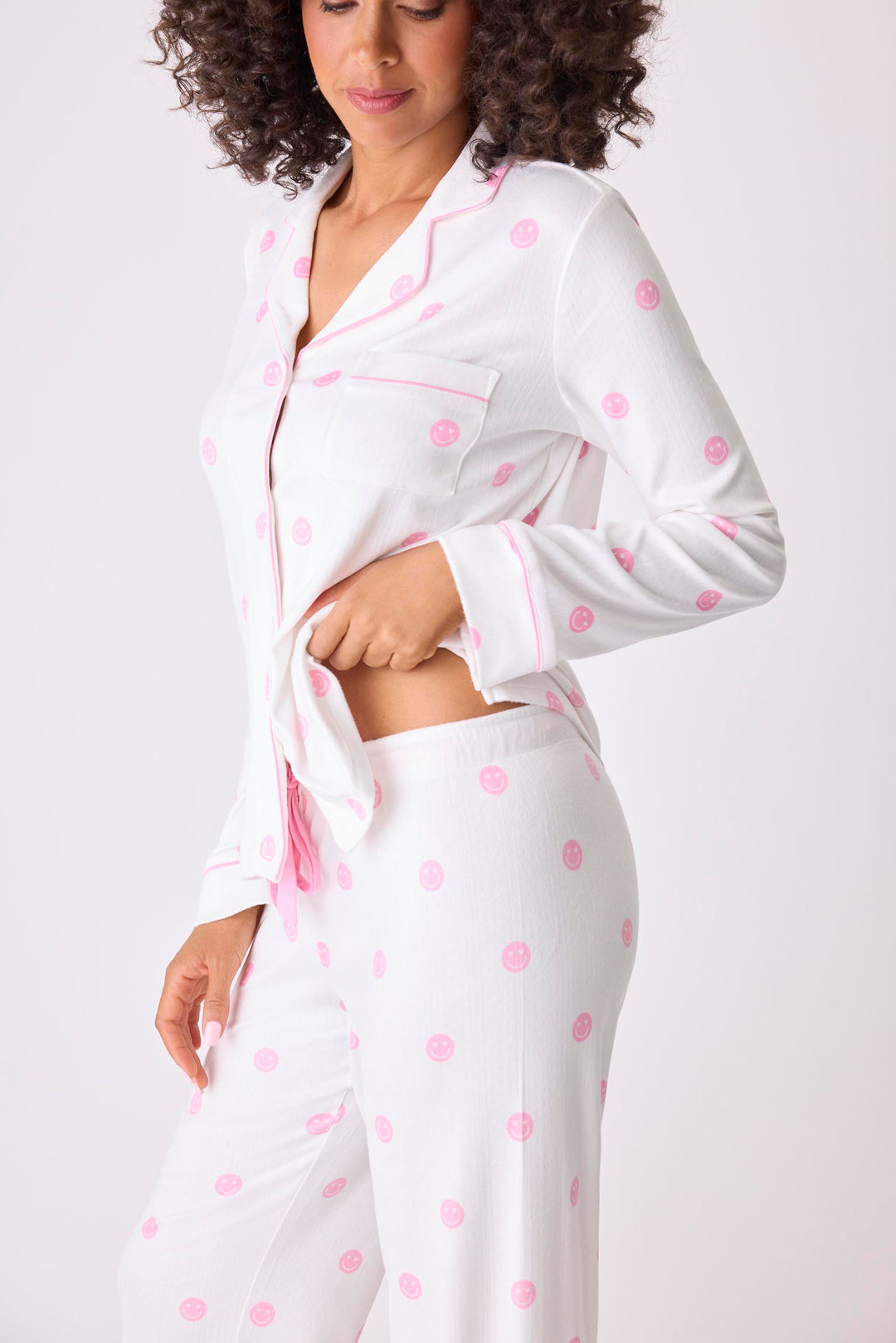 Women's ivory pajama set with pink happy face pattern. Exclusive PJS x Susan G Komen style.