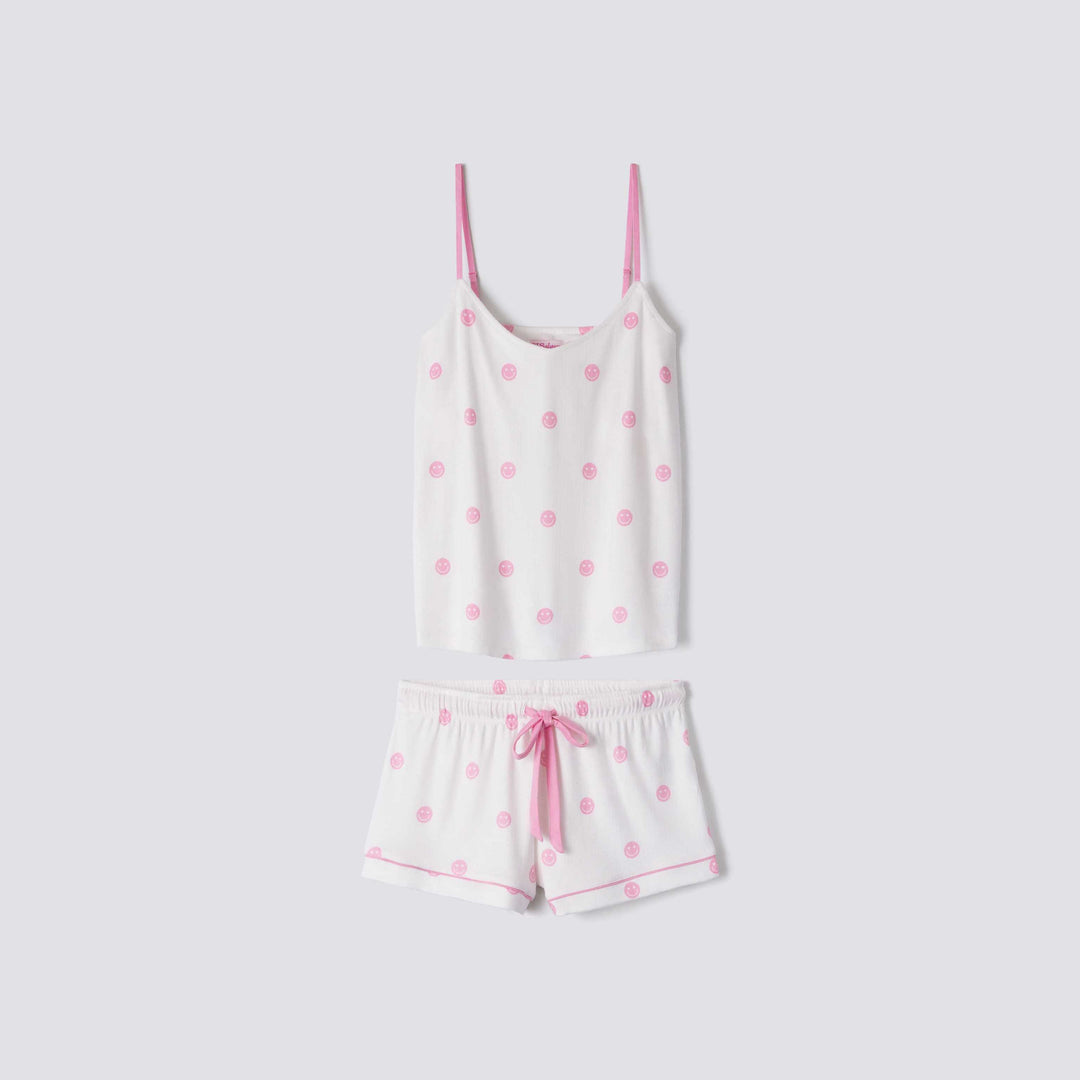 Women's cami-short sleep set in ivory with pink happy face print. Adjustable strap top & tie-waist short. Exclusive style to support partnership with Susan G Komen.