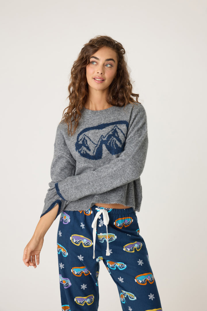 Women's soft sweater top in grey with navy ski-goggle graphic front. Navy tipping on sleeve cuffs.