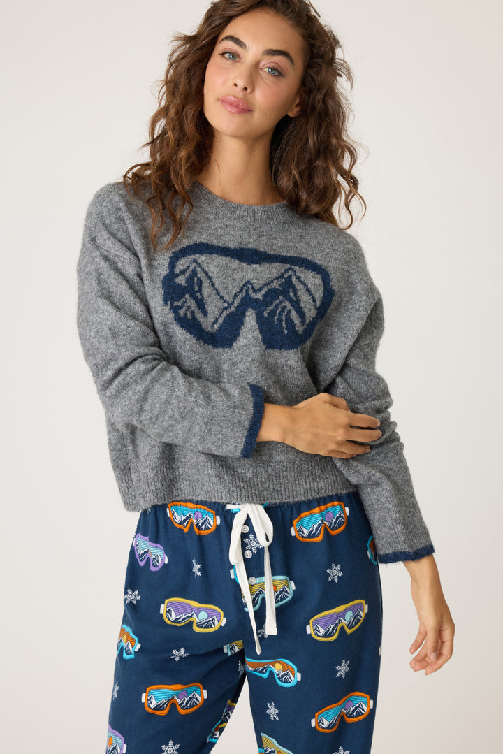 Women's soft sweater top in grey with navy ski-goggle graphic front. Navy tipping on sleeve cuffs.