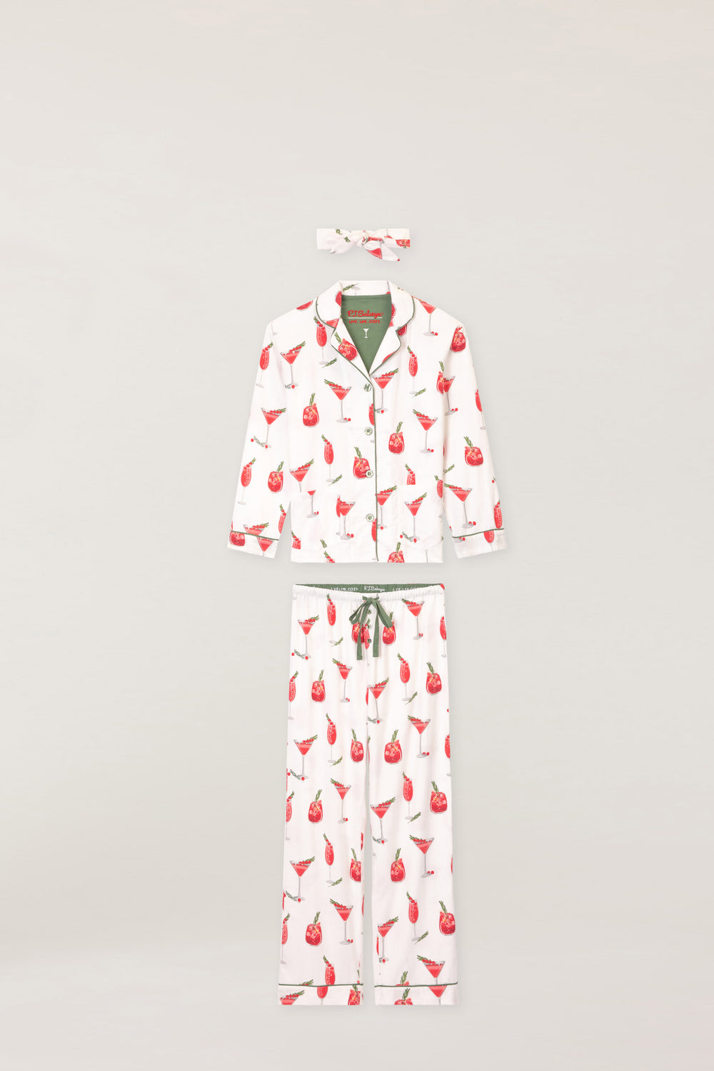 Women's cotton flannel pajama set in ivory & festive red cocktail print. Button-front collared top & tie-waist pant. Embroidered sleeve cuff "Warm Wishes & Cocktail Kisses". Includes matching hair wrap.