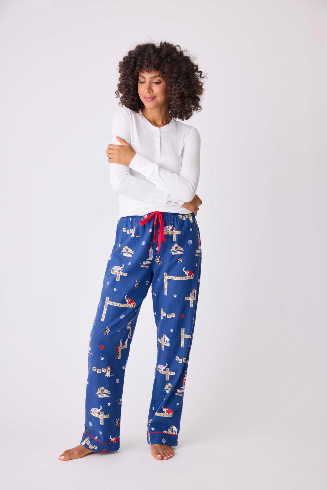 Women's cotton flannel pajama pant in dark blue dog-game print Tie waist. Exclusive style to support partnership with Love Leo Rescue ®