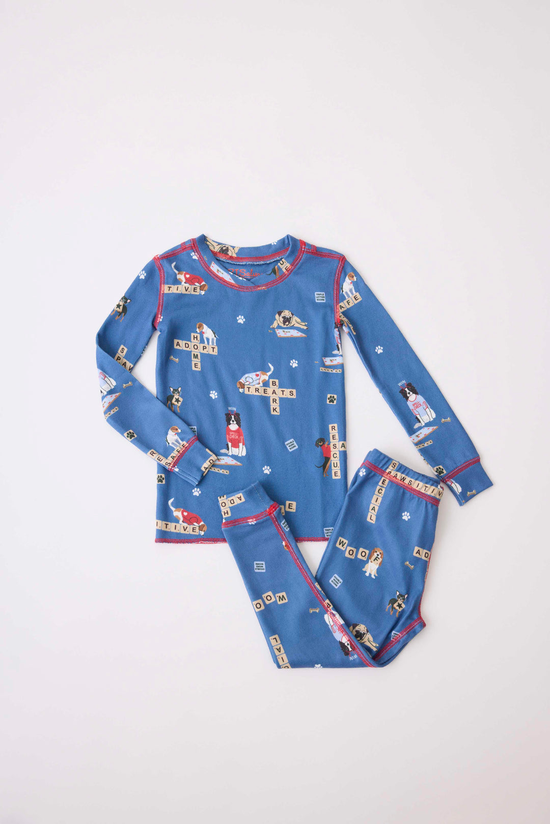 Kids two-piece pj set in gender-netural blue with dog-game print. Exclusive style to support partnership with Love Leo Rescue.