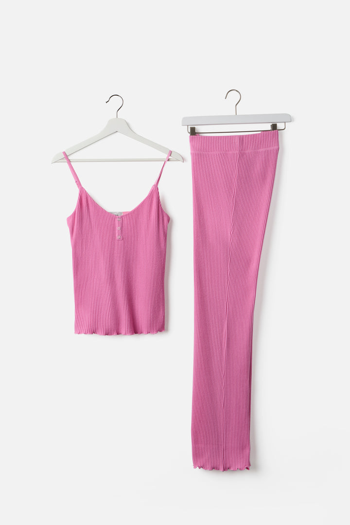 Pink sleep set camisole top & high-waisted pant. Made in Repreve x Reloved recycled soft knit.