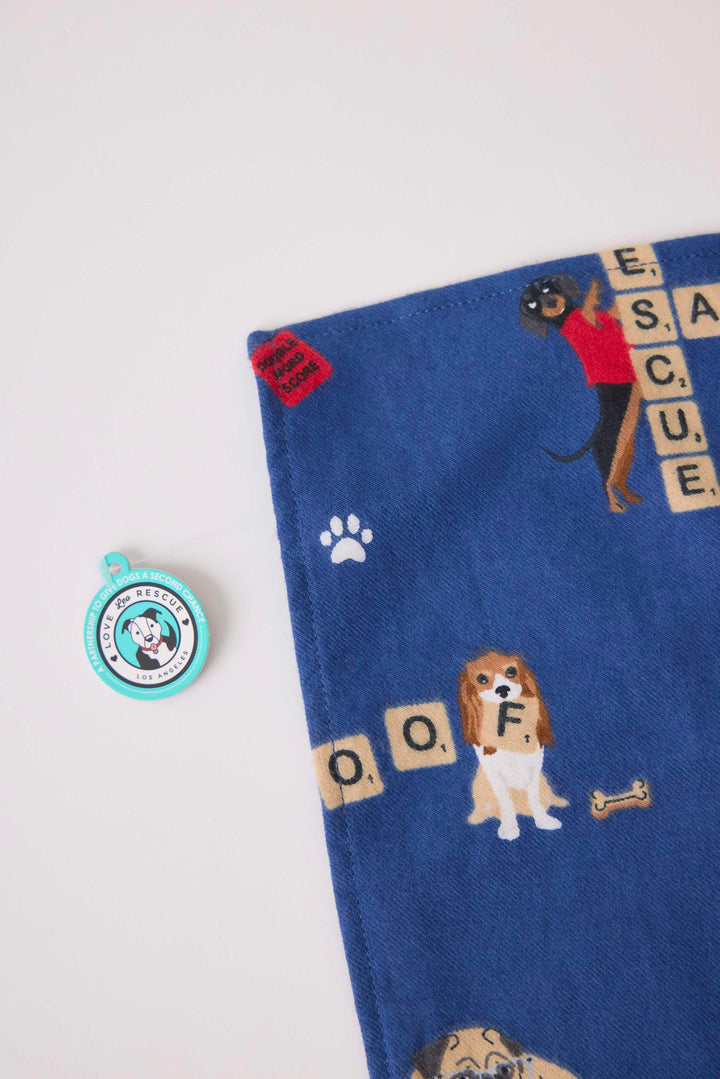 Bandana for dogs in dark blue with dog-game print. Exclusive style to support partnership with Love Leo Rescue.