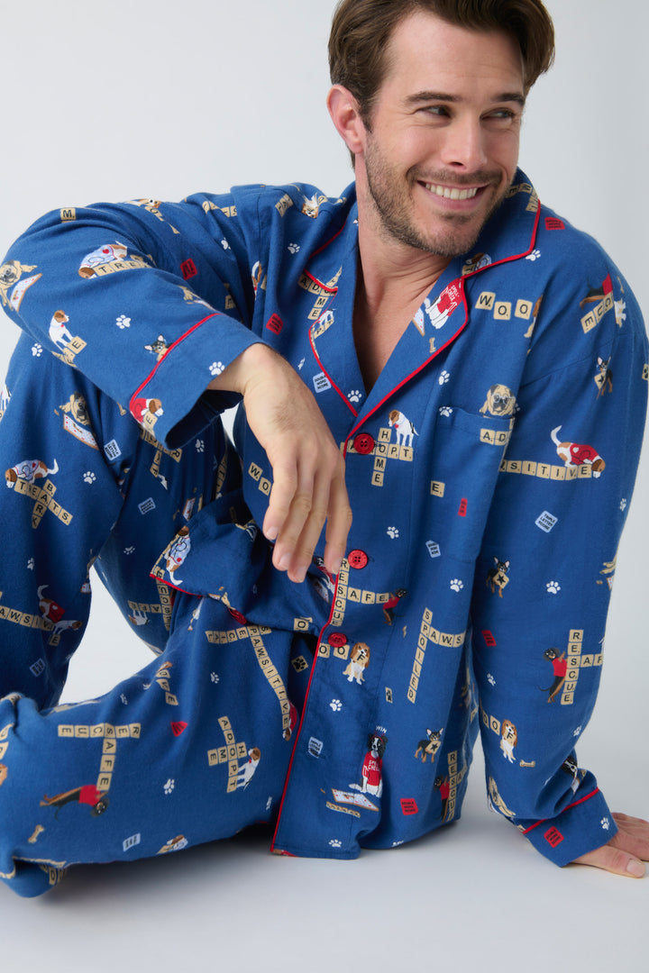 Men's cotton flannel pajama set in dark blue with dog-game print. Exclusive style to support partnership with Love Leo Rescue.