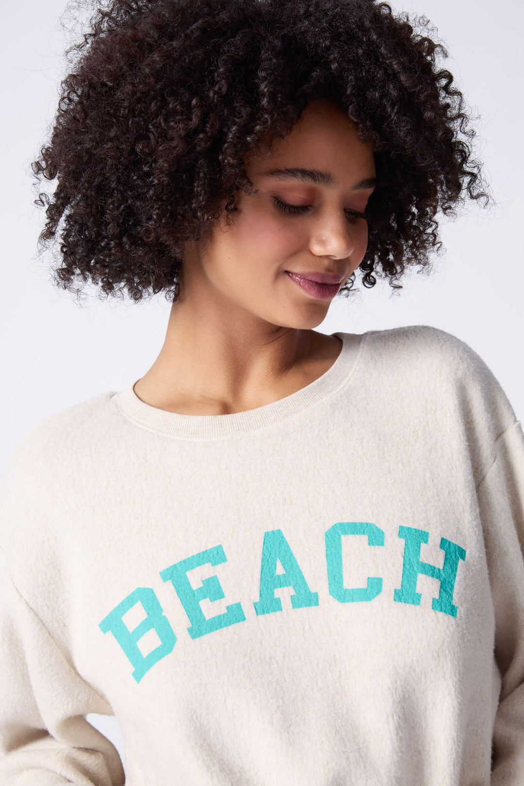 Women's natural cloud brushed terry top with graphic wave printed front.