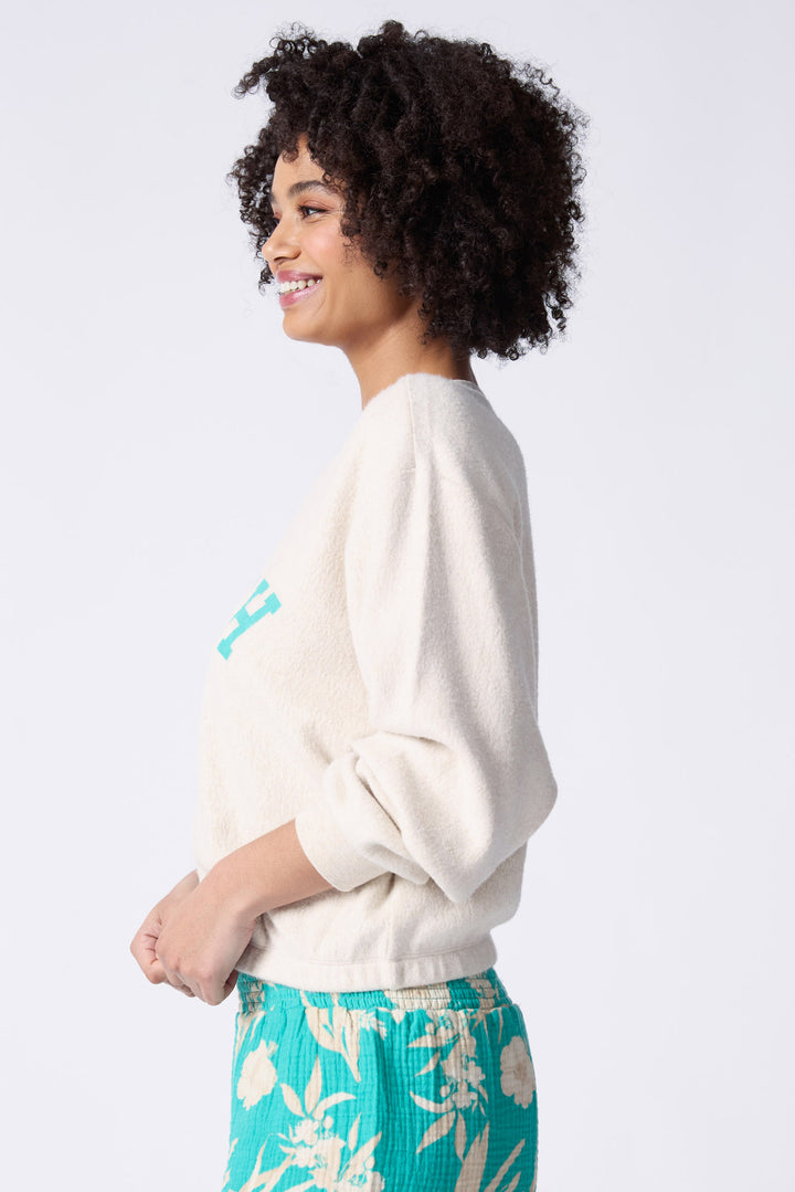 Women's natural cloud brushed terry top with graphic wave printed front.