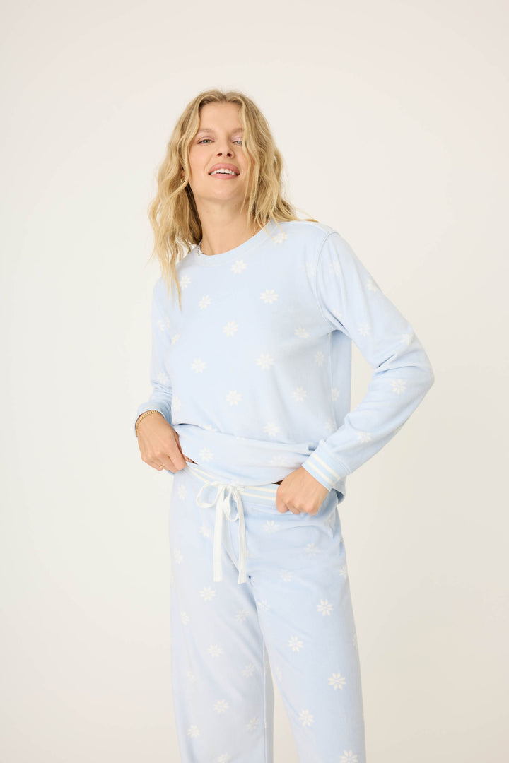 Women's long sleeve pale blue PJ top with white snowflake pattern.