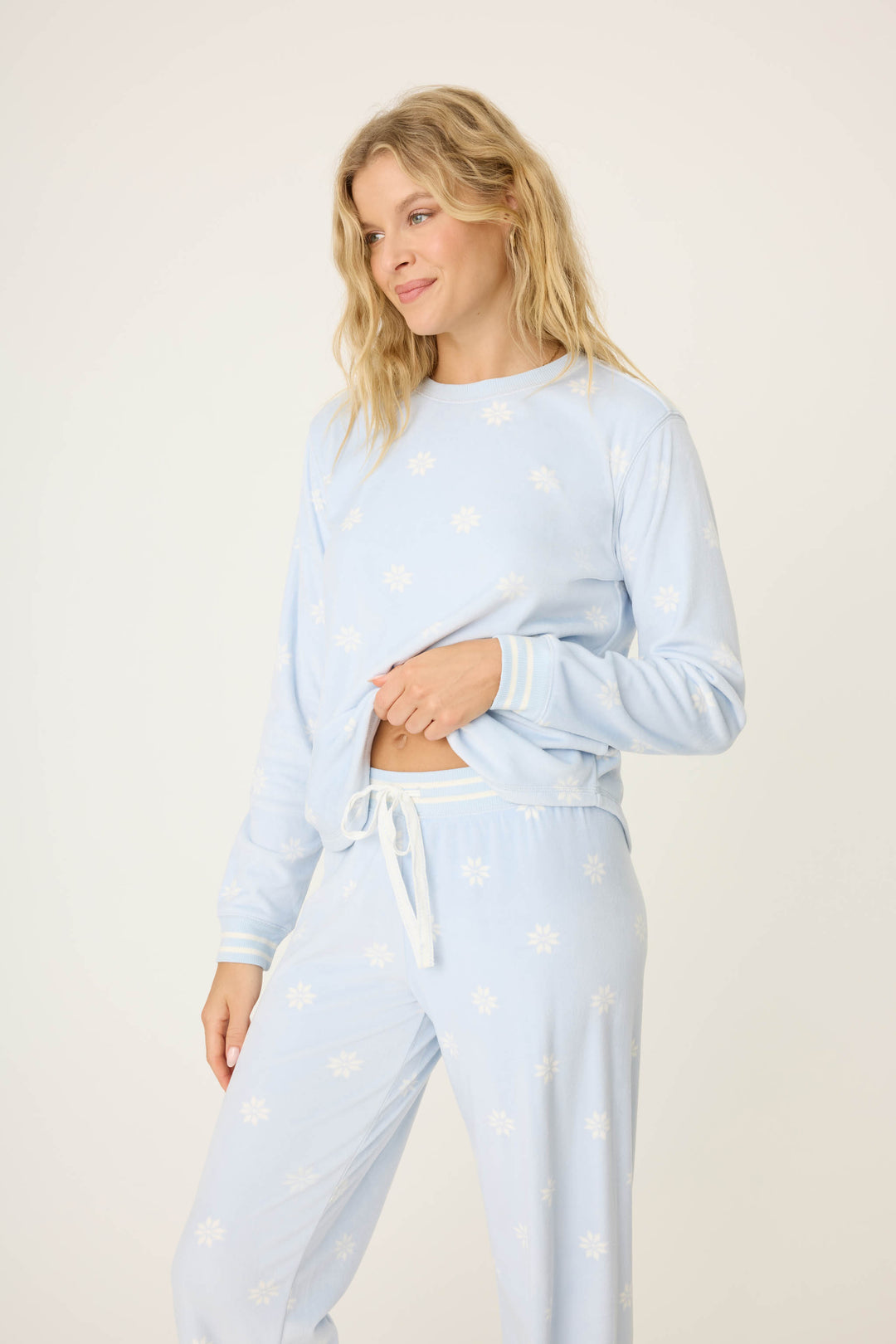 Women's long sleeve pale blue PJ top with white snowflake pattern.