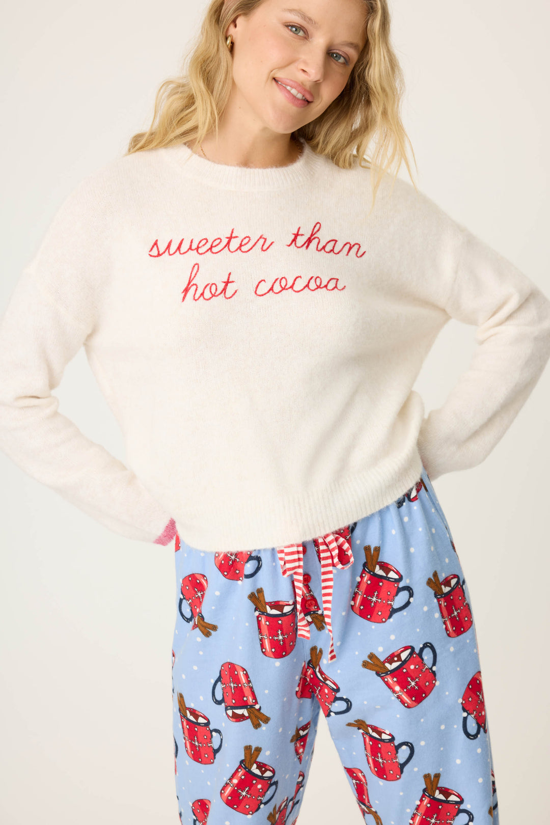 Women's ivory long sleeve pullover with 'sweeter than hot cocoa' on front.