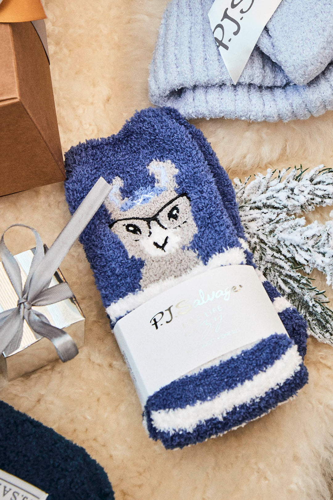 Women's blue and white striped socks with llama detail.