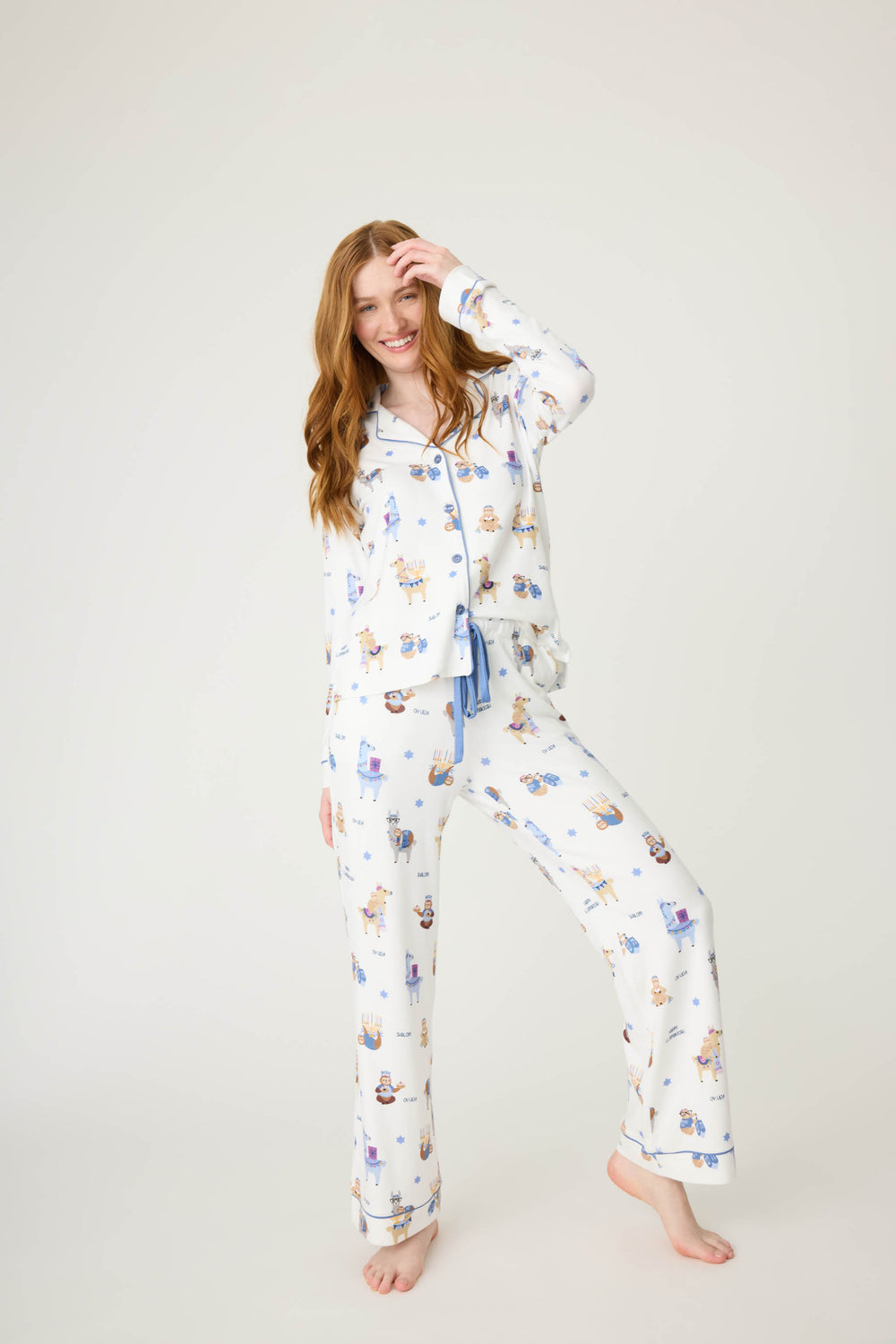 Women's white collared PJ top and tie waist pant with Hanukkah llama pattern.