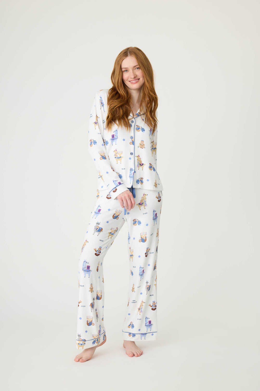 Women's white collared PJ top and tie waist pant with Hanukkah llama pattern.