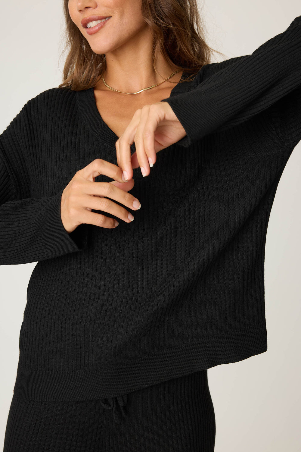 Women's black luxe ribbed lounge long sleeve with v-neck.