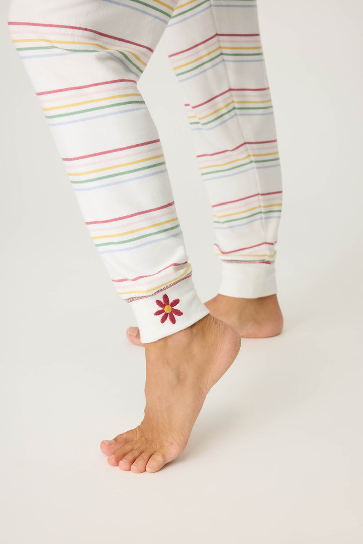 Women's white and multi-color stripe banded PJ pant with tie waist and flower embroidery on ankle.