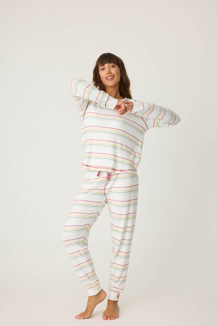 Women's white and multi-color stripe banded PJ pant with tie waist and flower embroidery on ankle.