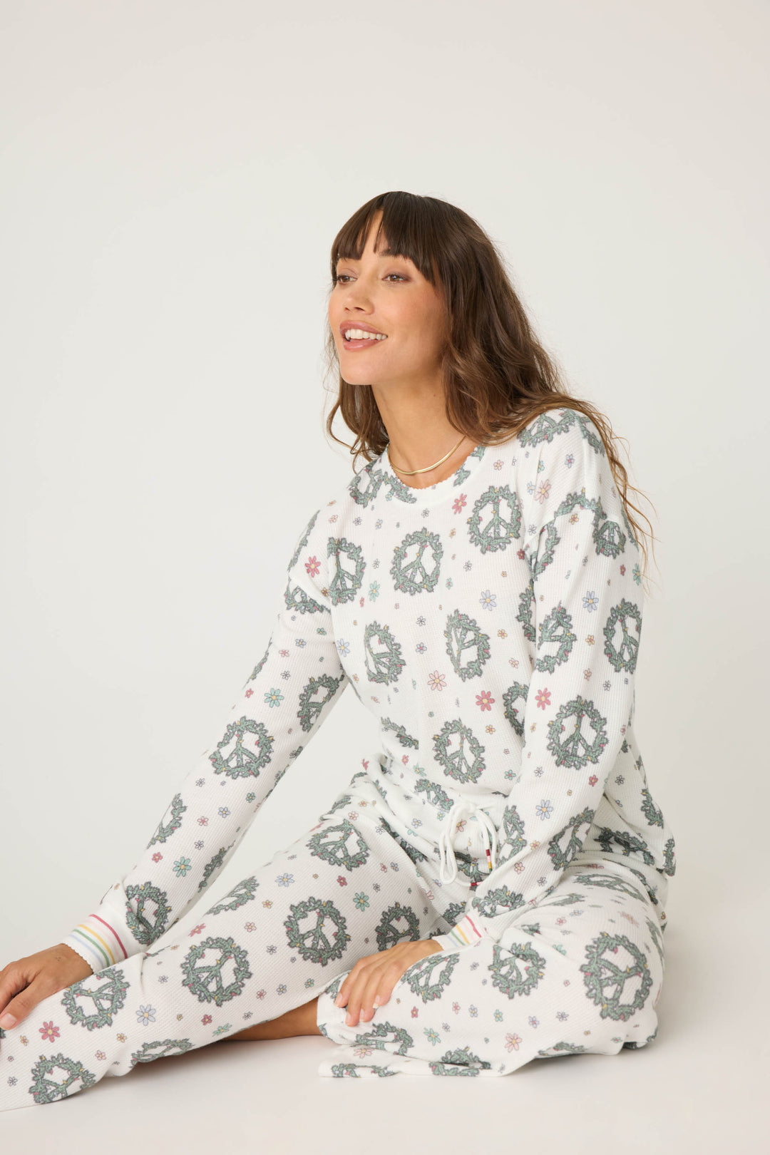 Women's white and green peace pattern lounge hoodie and lounge pant.