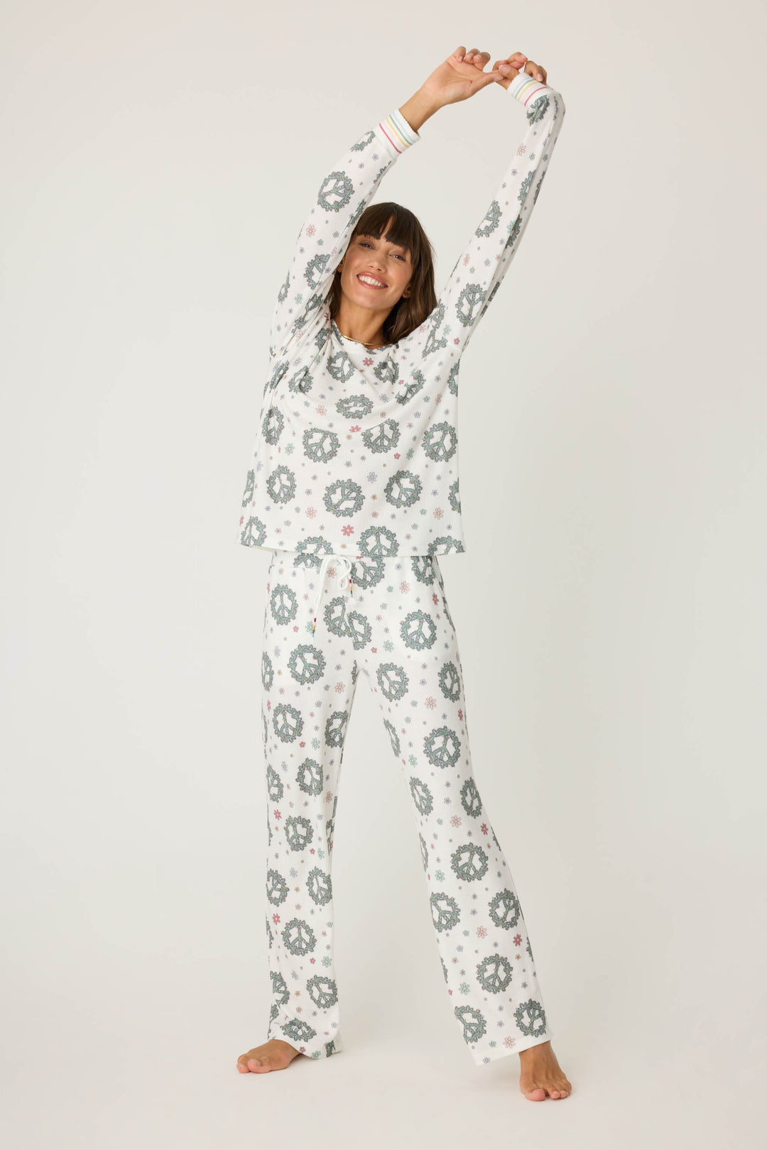 Women's white and green peace pattern lounge hoodie and lounge pant.