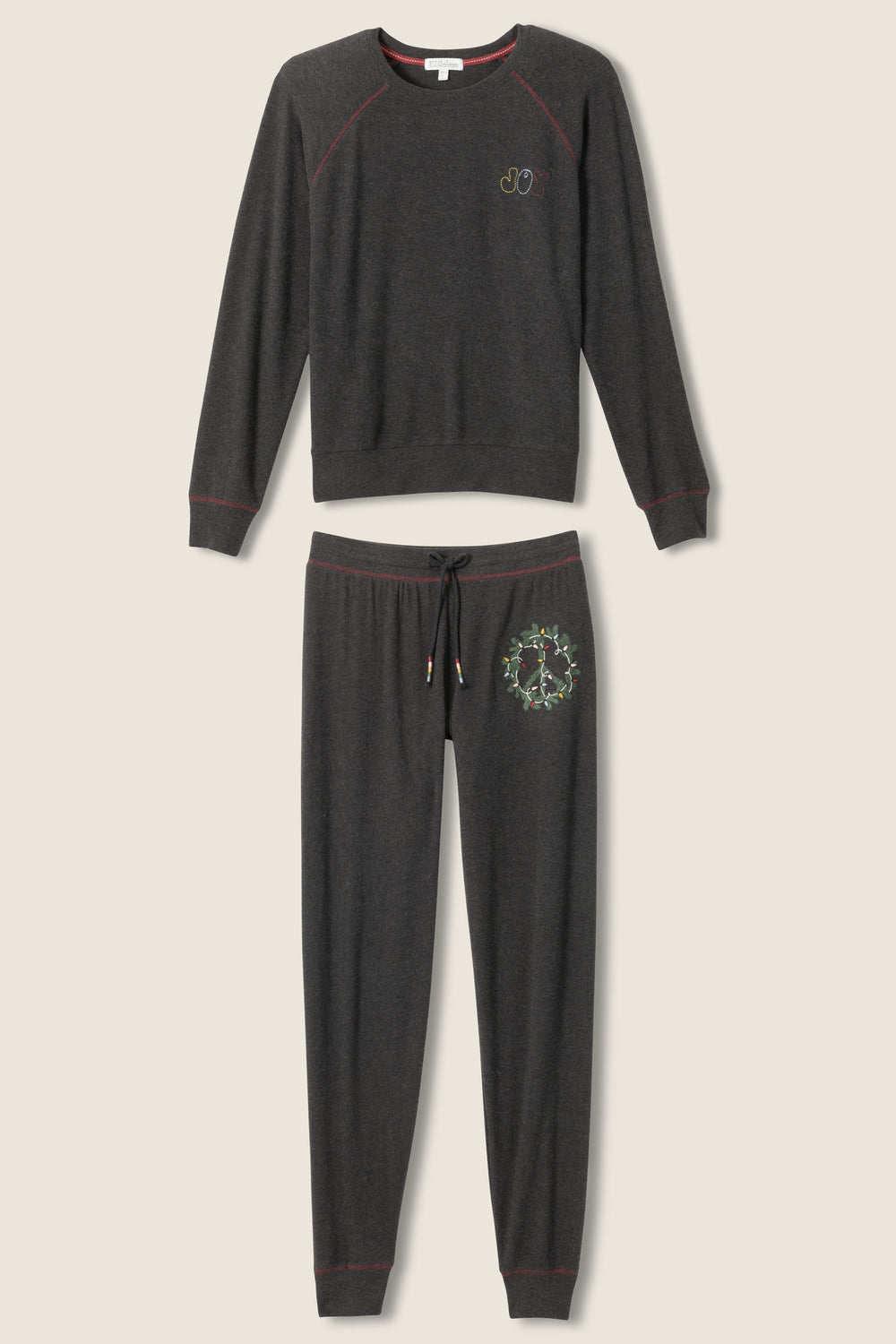 Women's black lounge hoodie and lounge pant with green peace logo.