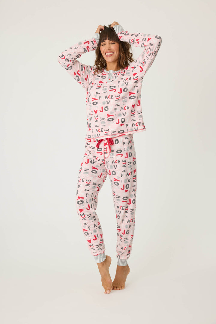 Women's pale pink jammie top and banded PJ pant with joy and peace pattern.