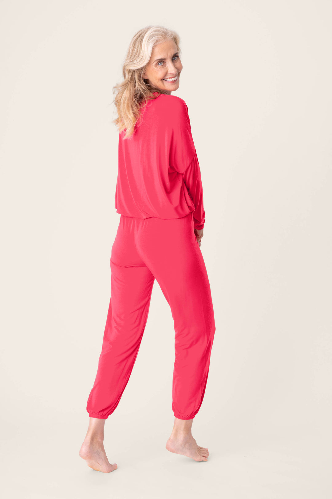 Women's hot pink lounge long sleeve top with banded jogger lounge pants.