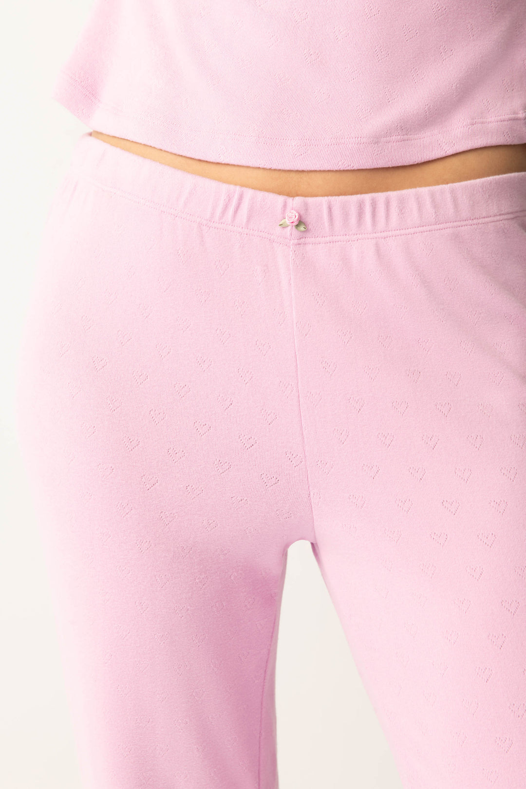 Women's pink banded pj pant with satin rose on waistband.