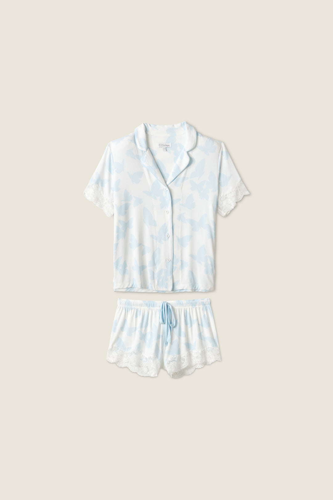 Women's pajama short set in ivory-blue butterfly printed modal jersey. Button front short sleeve top & tie waist short.