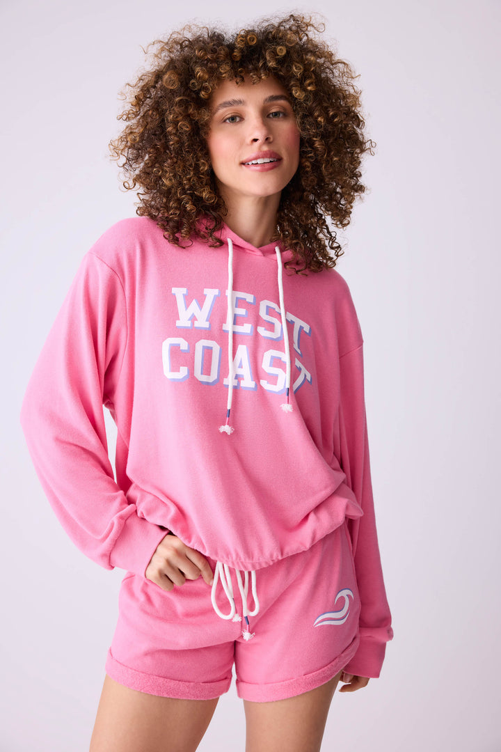 Women's vintage fleece jogger set in pink with WEST COAST graphic print.