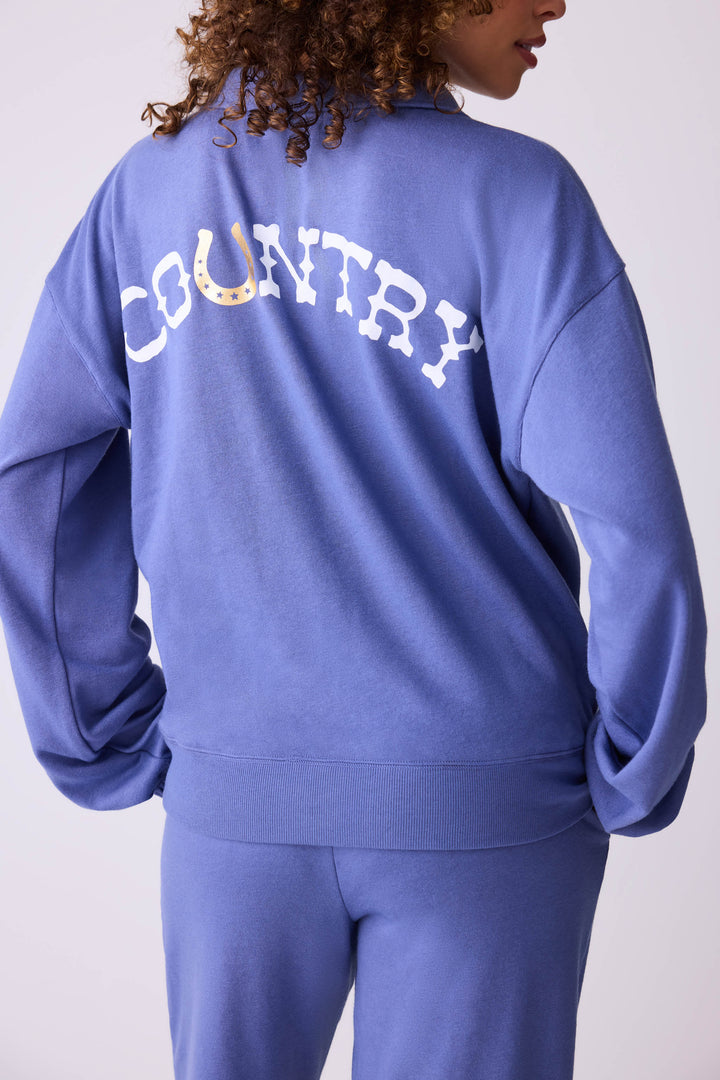 Women's vintage fleece jogger set in navy blue with COUNTRY graphic print.