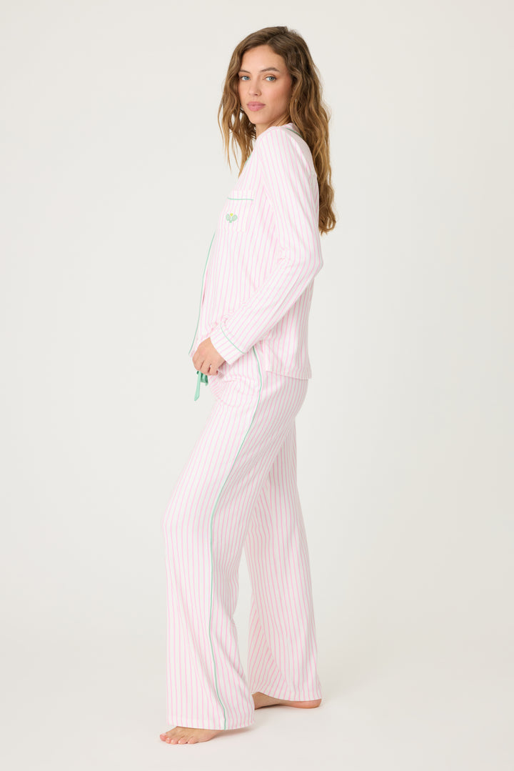 Ivory & pink striped pajama set in butter jersey. Button front top & tie pant have contrast pink piping. Includes embroidered eyemask "Apres Pickelball". Chest pocket with embroidery.