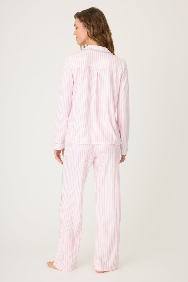 Ivory & pink striped pajama set in butter jersey. Button front top & tie pant have contrast pink piping. Includes embroidered eyemask "Apres Pickelball". Chest pocket with embroidery.