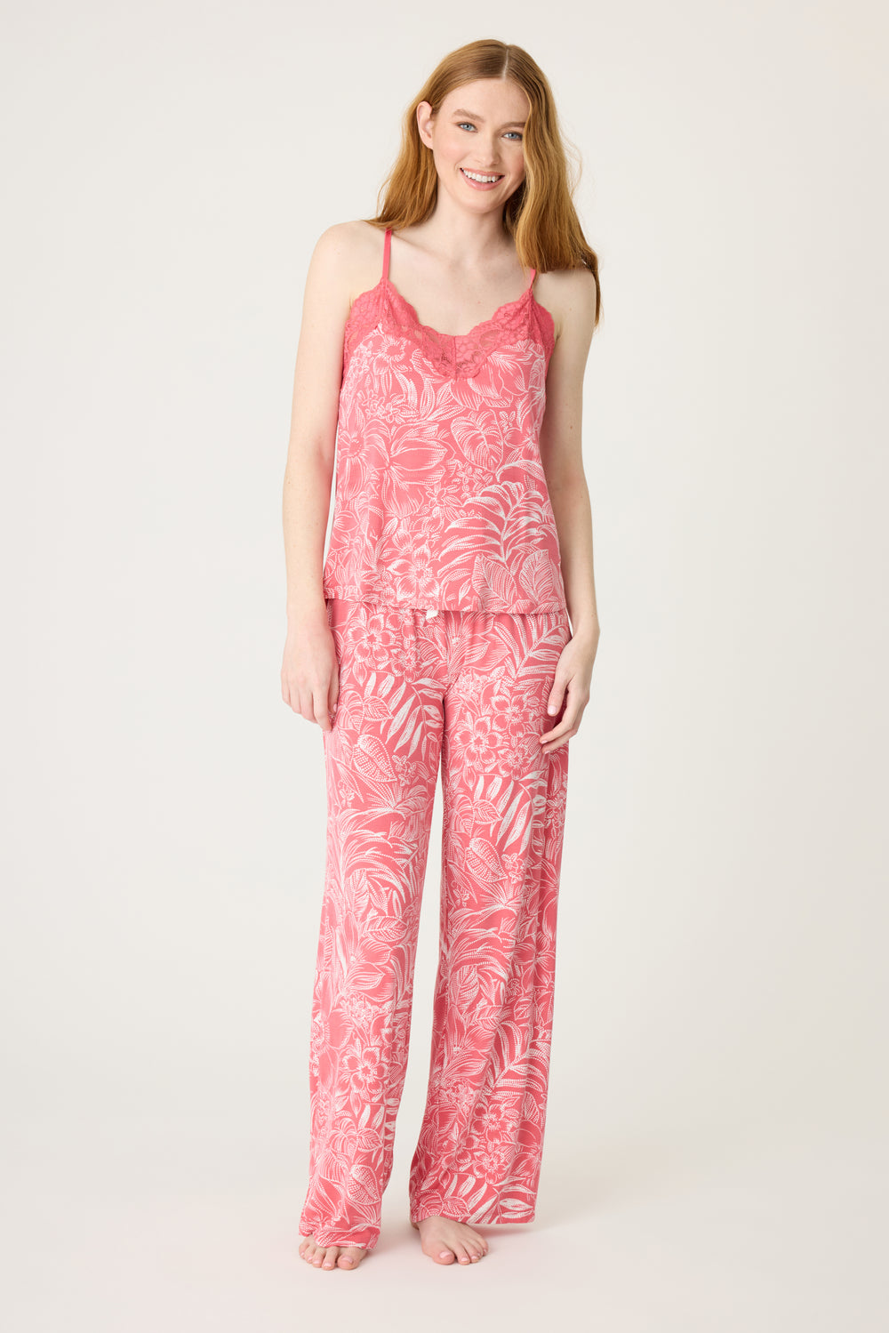 Pink floral modal women's sleep set. Camisole top with scallop lace neck & adjustable straps with shelf bra. PJ pant has side pockets & tie waistband.