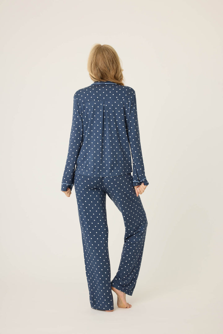 Women's navy blue w/ivory polka dot pajama set in modal jersey. Top is button-front with collar & contrast piping. Pant has tie waist & contrast piping on sideseams.