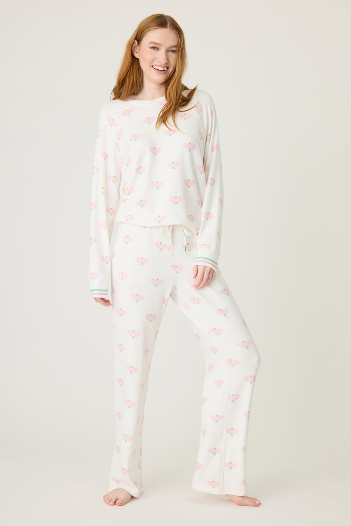 Women's lounge set top & pant in racket printed peachy in ivory-pink pattern, with pink & green stripe waist & sleeve cuffs.