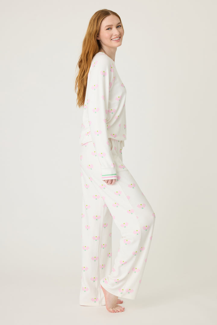 Women's lounge set top & pant in racket printed peachy in ivory-pink pattern, with pink & green stripe waist & sleeve cuffs.