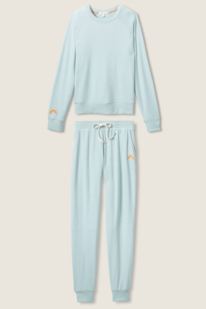 Women's blue melange lounge set top & jogger with small rainbow embroidery on cuff.