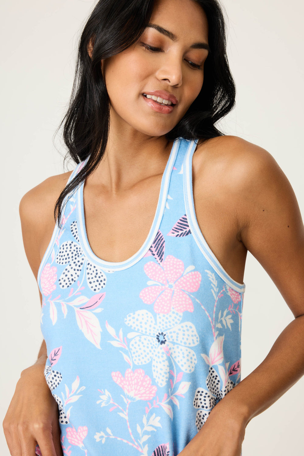 Women's ivory-blue-pink winter floral sleep tank top. Racer back has striped trim. Relaxed, curved hem.