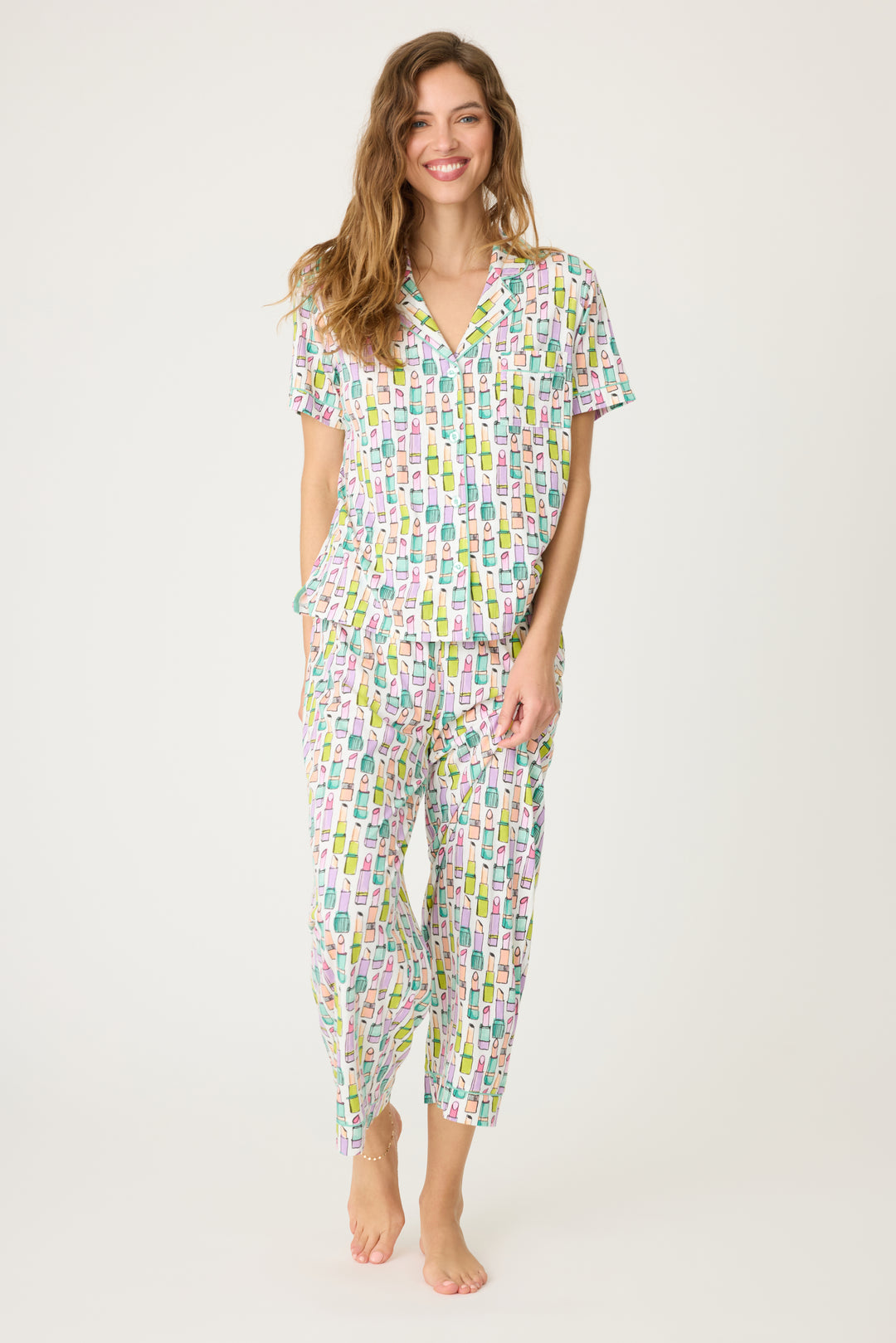 Women's breathable cotton-modal jersey short sleeve pajama set in ivory with multi lipstick print. With teal contrast piping & tie. Button-front top & open leg pant.