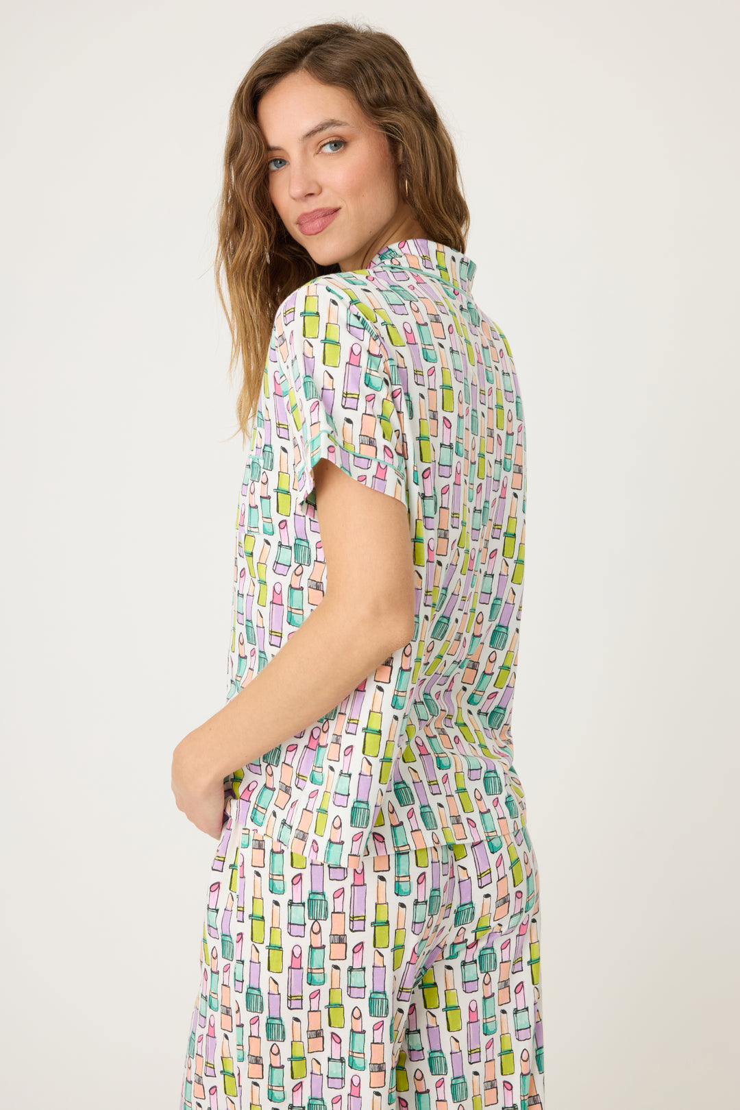 Women's breathable cotton-modal jersey short sleeve pajama set in ivory with multi lipstick print. With teal contrast piping & tie. Button-front top & open leg pant.